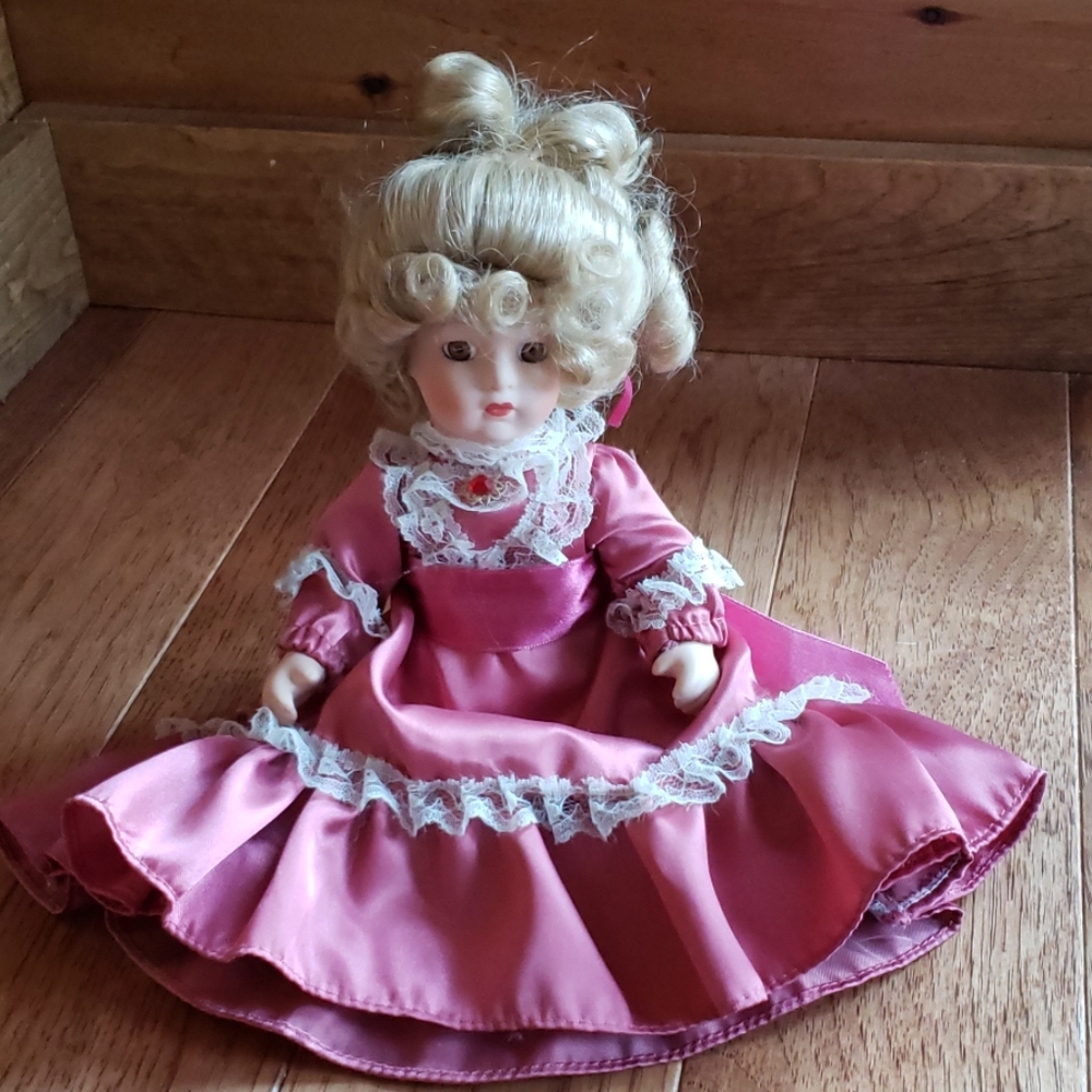 Porcelain Doll by Janis Berard